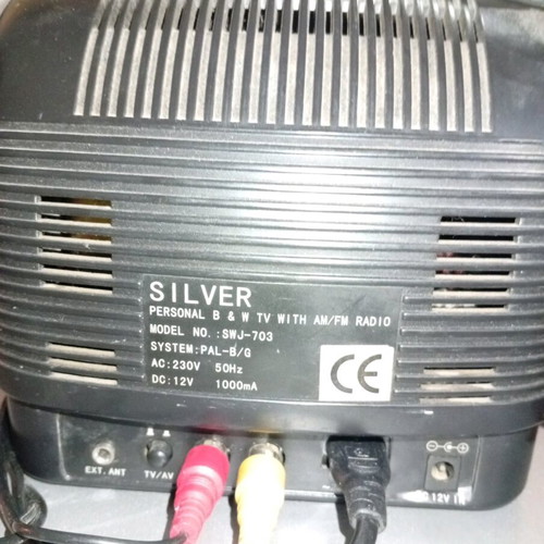 Silver portable radio TV used with AV and car adapter
