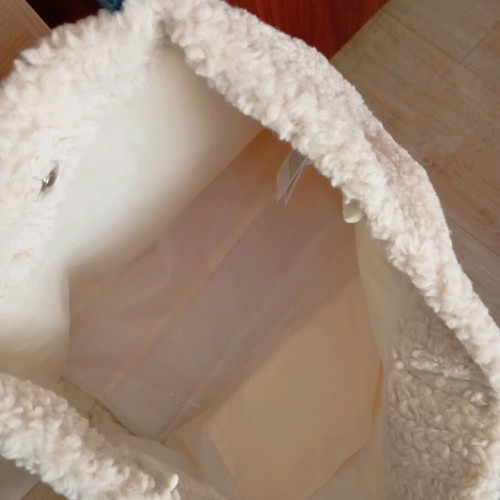 Shoulder bag with furry fabric