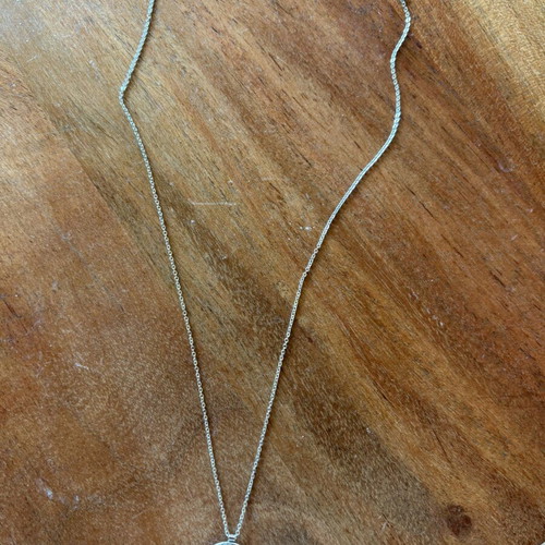 Steel necklace chain with mother-of-pearl and zircon pendant