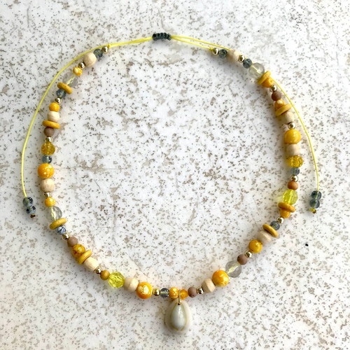 Necklace with shell and yellow beads
