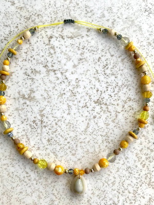 Necklace with shell and yellow beads