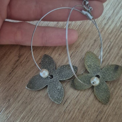 Hoop earrings used with metal flowers and pearl detail