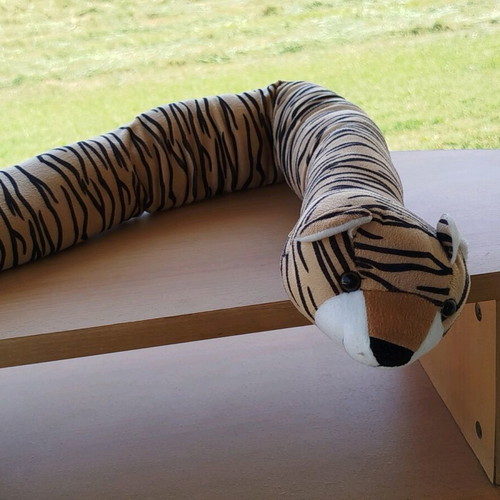 Plush door draft stopper like new, 82 cm length