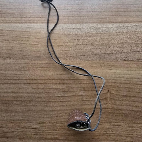 Hanging lighter case like new, carved design