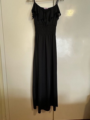 Maxi black dress with lightweight fabric and slight transparency