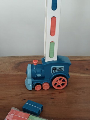 Domino train automatic toy with 56 domino pieces