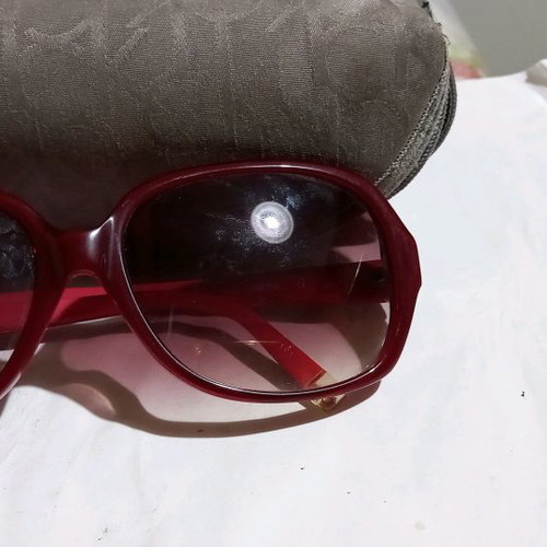 Calvin Klein sunglasses used, red frame with brown gradient lenses