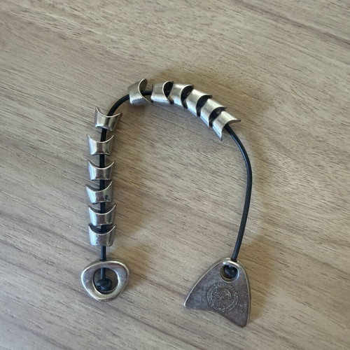 Vintage Olympiacos S.F.P. komboloi with metal elements, used