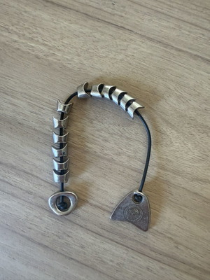 Vintage Olympiacos S.F.P. komboloi with metal elements, used