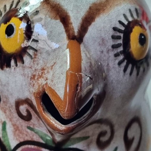 Ceramic owl pitcher used, broken and glued on the beak