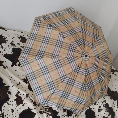 Vintage unisex folding umbrella with wooden handle, used