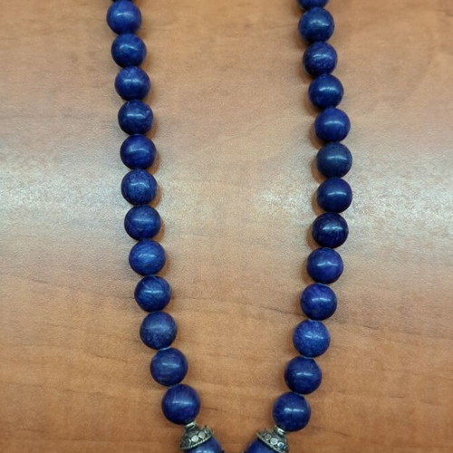 Necklace with blue semi-precious stones and silver setting like new