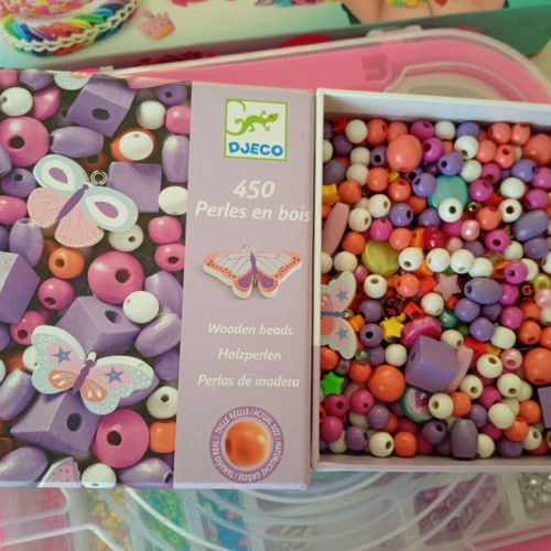 Bracelet making set used with beads and tools, includes Lego bracelet