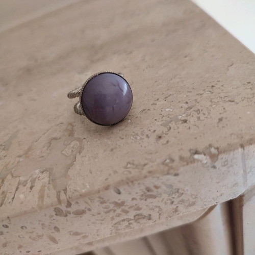 Faux ring with purple stone used, adjustable size