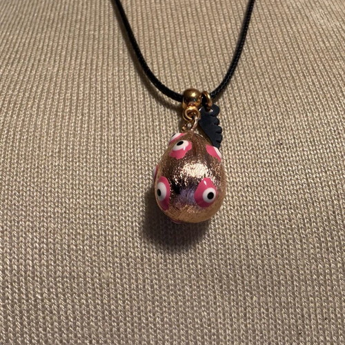 Easter egg pendant like new with leather cord