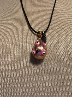 Easter egg pendant like new with leather cord