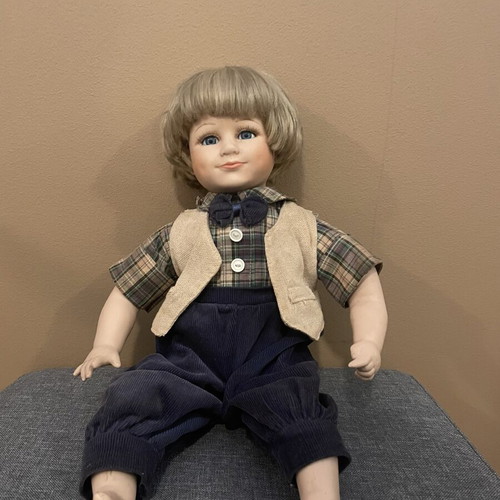Porcelain collectible boy doll like new, 43 cm tall with fabric clothes