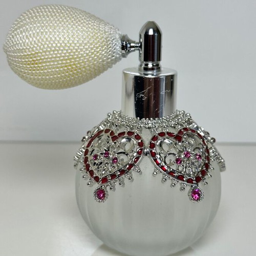 Vintage perfume bottle with pump, decorative hearts and crystals