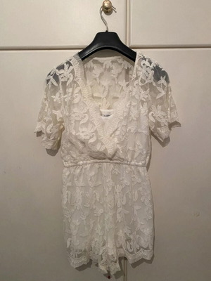 One-piece romper size S like new, white with transparent details