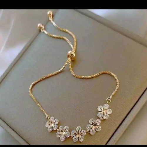 Delicate cubic zirconia bracelet new, gold and white