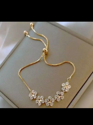 Delicate cubic zirconia bracelet new, gold and white