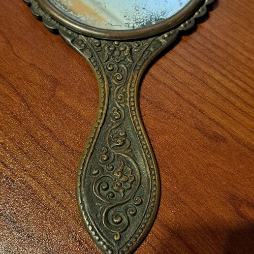 Brass hand mirror used with embossed peacock decoration