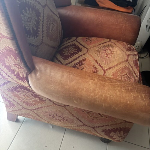 Kourtis armchair used with leather arms in brown tones