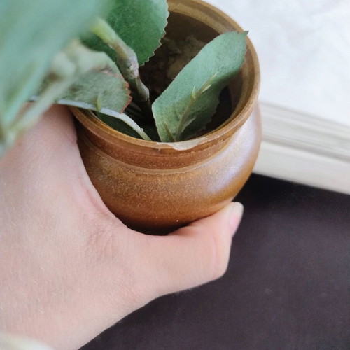 Decorative ceramic vase with artificial flowers used
