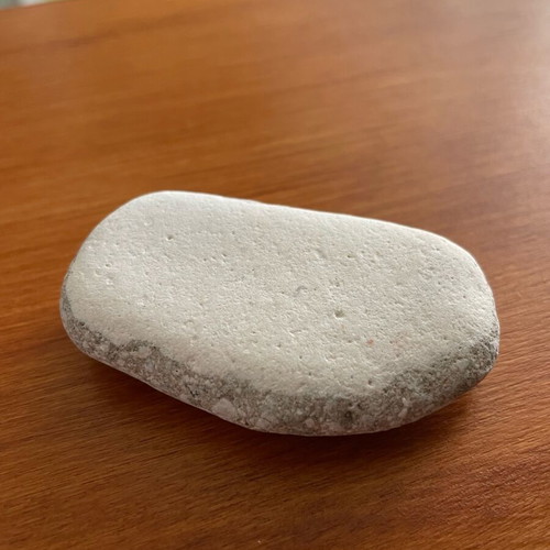 Natural limestone pebble new, smoothed from beach