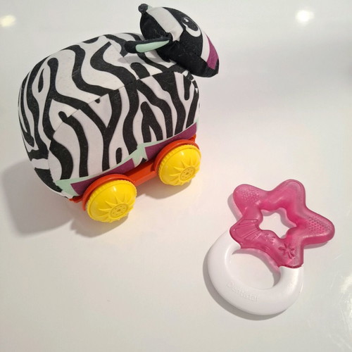 Luna fabric animal with wheels and teether star like new