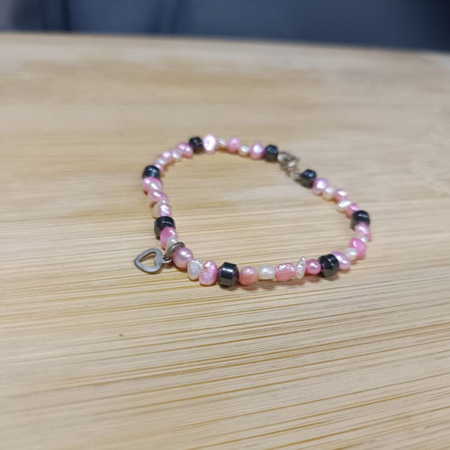 Bracelet with white, black and pink stones, heart charm