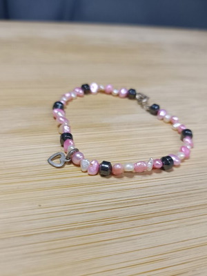 Bracelet with white, black and pink stones, heart charm