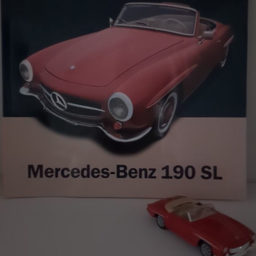 Mercedes-Benz 190 SL collectible with booklet and metal model, like new