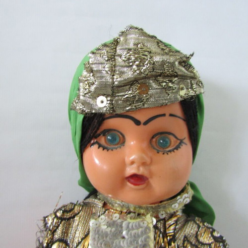Vintage souvenir doll with traditional oriental costume used