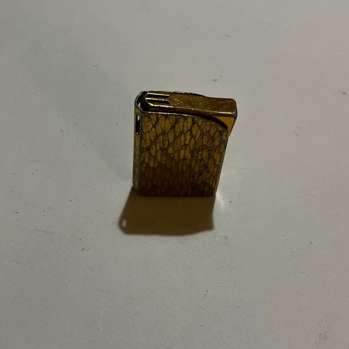 Gold lighter used with damages, not working