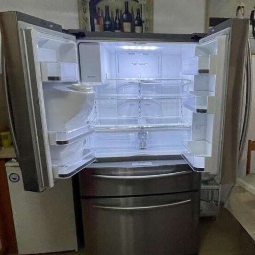 Samsung side by side refrigerator with ice maker and water filter, model FR24FSEDBSR