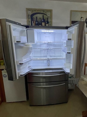 Samsung side by side refrigerator with ice maker and water filter, model FR24FSEDBSR