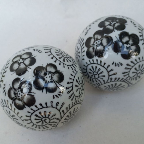 Vintage decorative porcelain spheres set like new with floral and geometric designs