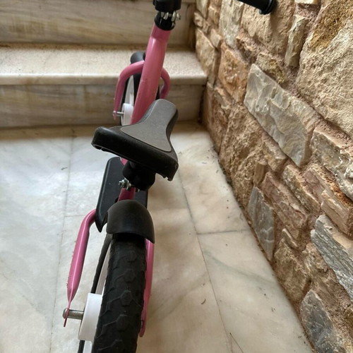 Balance bike pink like new with minor scratches on handlebar
