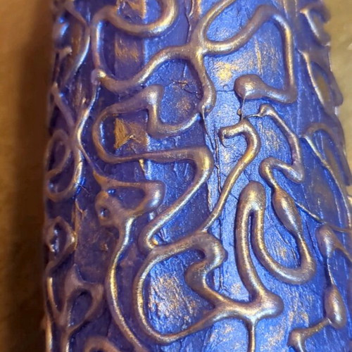 Hand-painted bottle used with embossed patterns