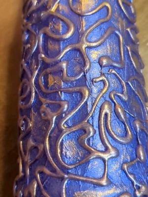Hand-painted bottle used with embossed patterns