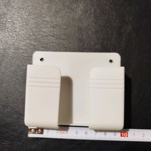 Mobile phone charging holder new, white PVC, fits phones up to 9 cm