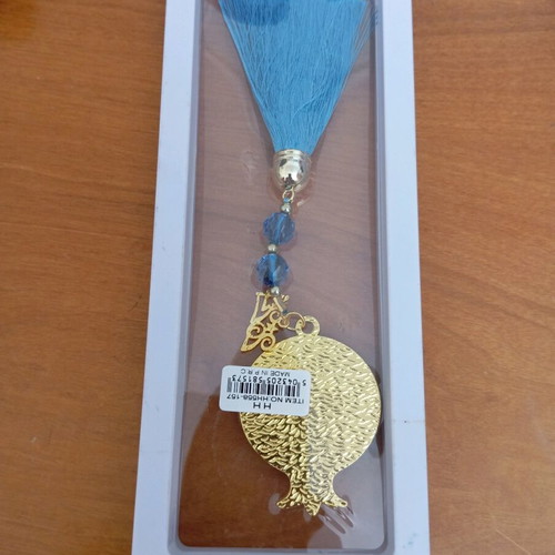 Decorative hanging like new with blue tassel and metal pomegranate