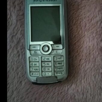 Old mobile phone used, no charger, unknown if working