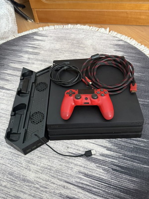 Sony PlayStation 4 Pro 1TB console used with controllers and charging dock