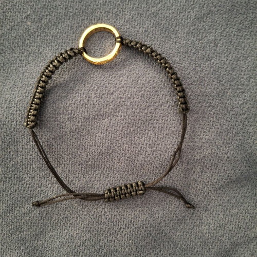 Bracelet like new in black color with gold details