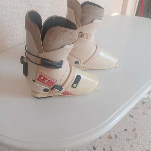 Rossignol STS Fibroplastic skis used with Tyrolia 260 bindings, Skitique poles, and Solomon SX81 325 boots