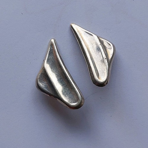 Silver earrings used with clip