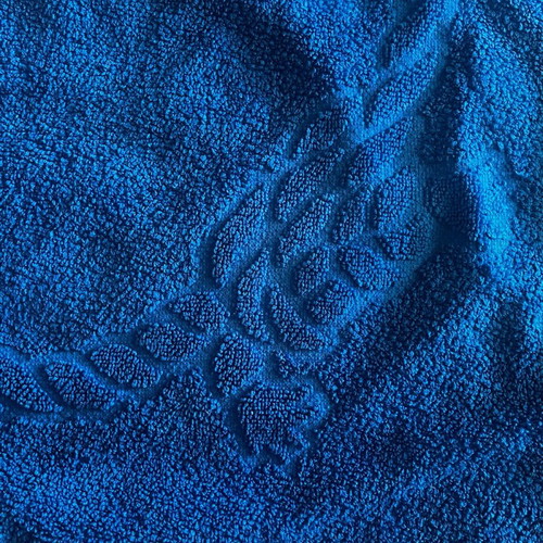 Large cotton bath towel new, blue with embossed design
