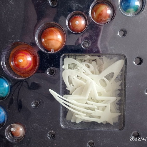 Educational toy used with solar system and glow-in-the-dark stars